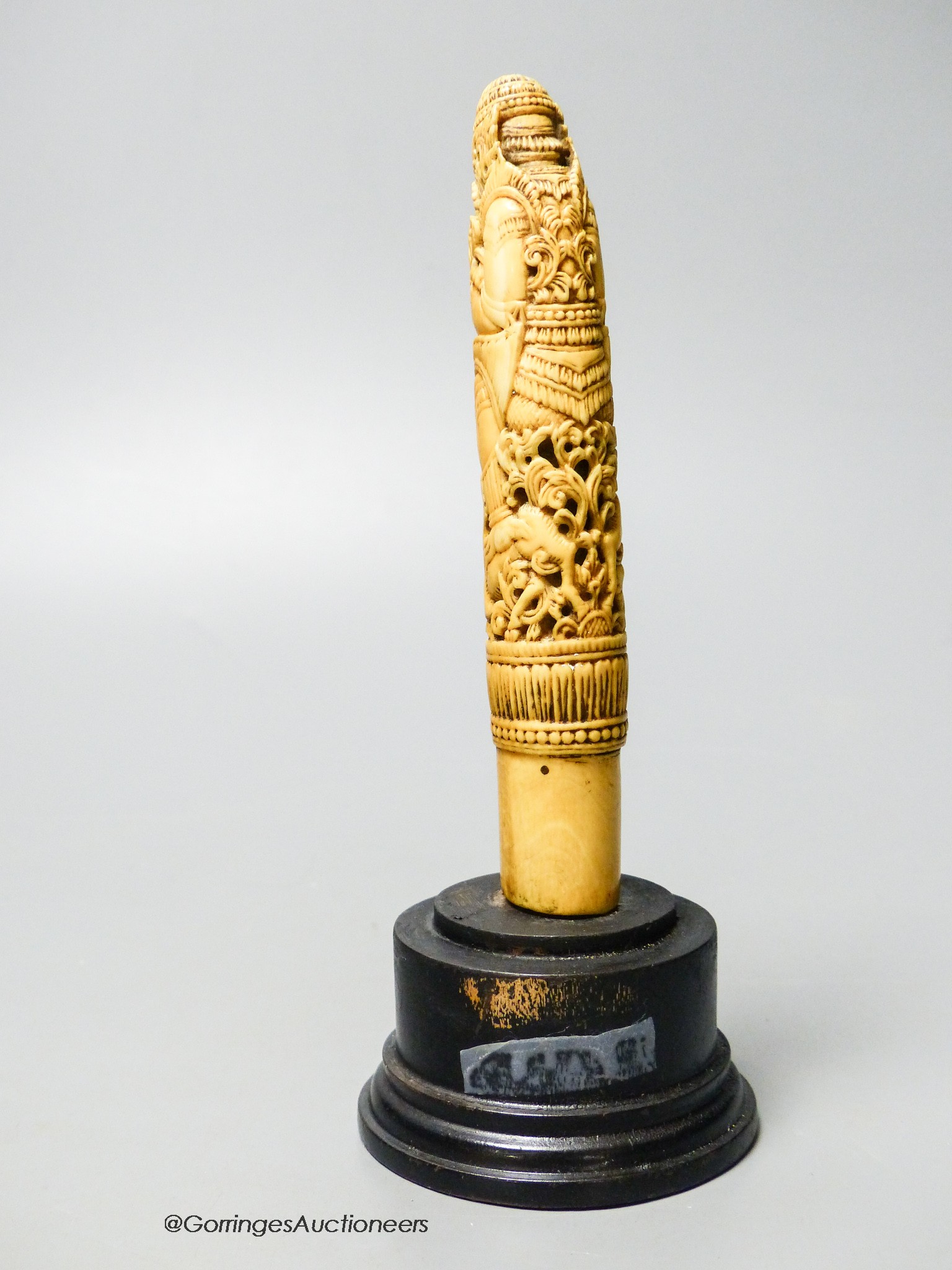 A 19th century Indonesian ivory Dha handle, on plinth, height 18cm